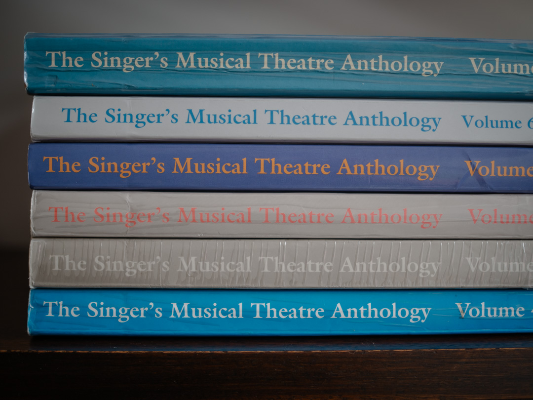 Collection of sheet music books for singers, an essential resource when following musical theatre audition tips.