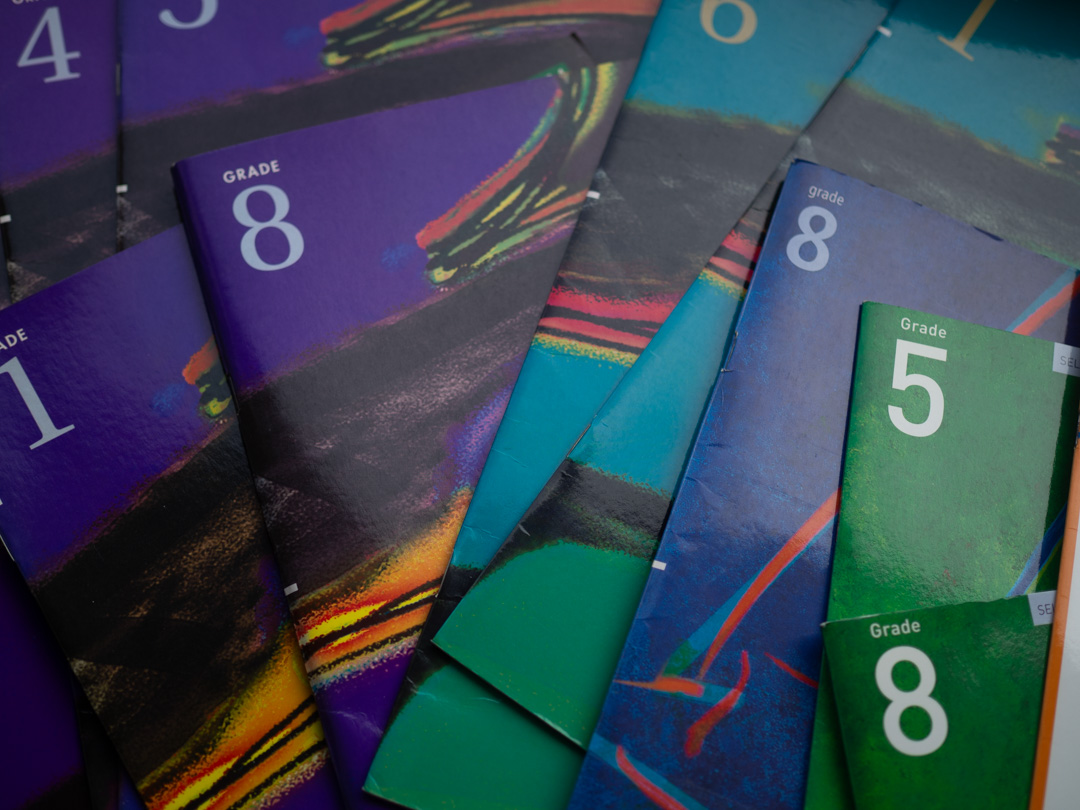 A selection of ABRSM piano exam books used for graded music exams